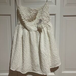 Mini white dress,straps are included (Never worn)